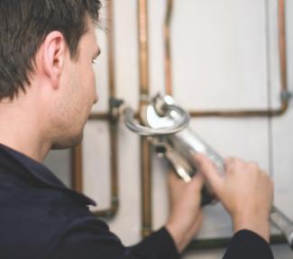 Man fixing pipe